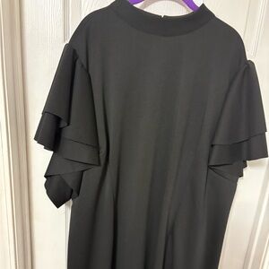 Plus size women’s black dress with flirt sleeves
